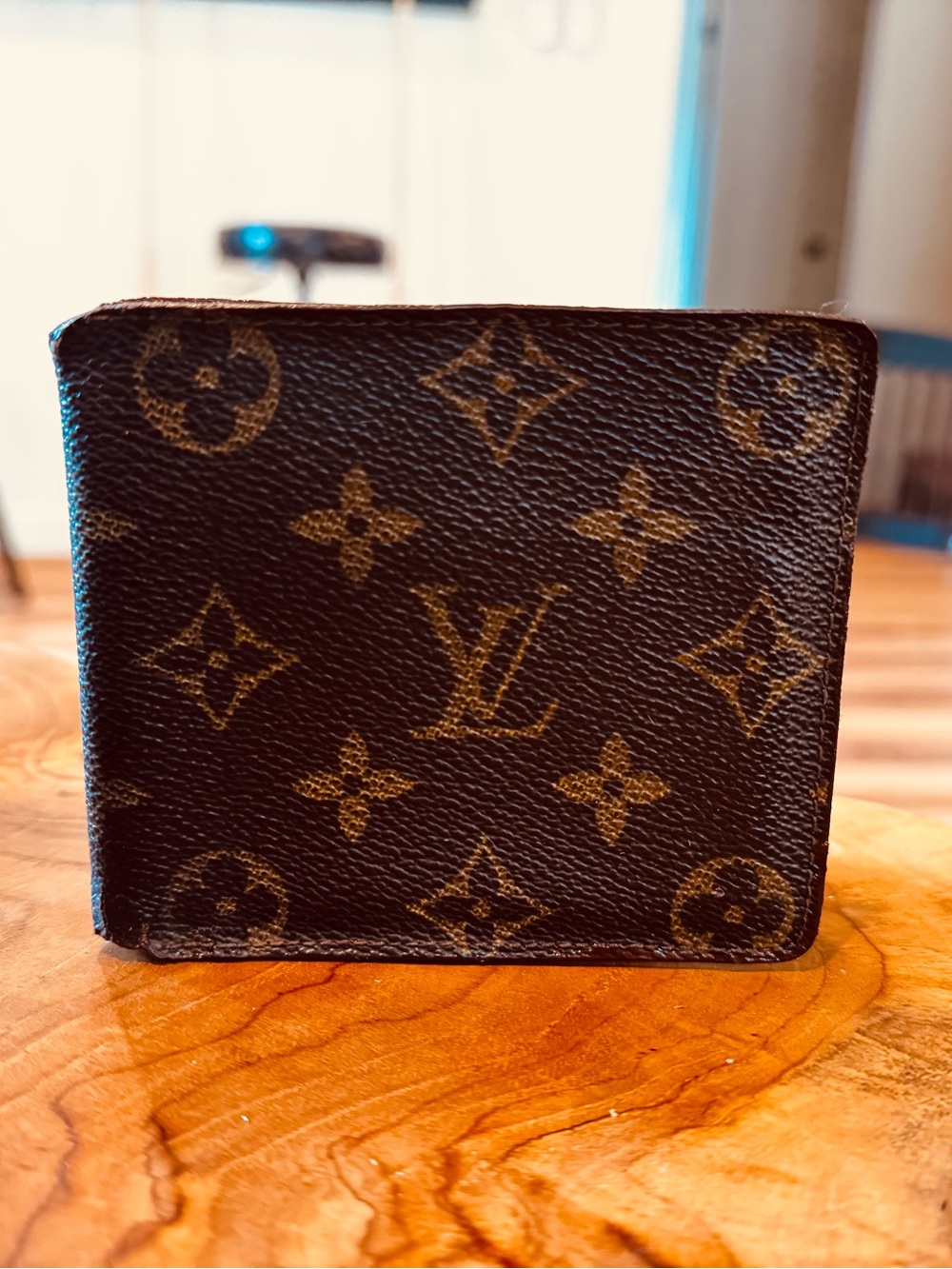 Louis Vuitton men’s monogram bifold wallet, damaged